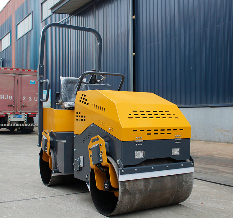 How does a road roller coordinate with other construction machinery during construction?